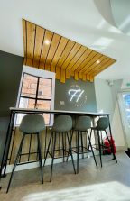 Bar style seating area in Holmes Sweet Homes Cafe interior