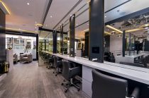 Row of workstations and mirrors at a hair salon