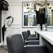 Styling area and workstations in a hair salon designed by Retail Experience Design